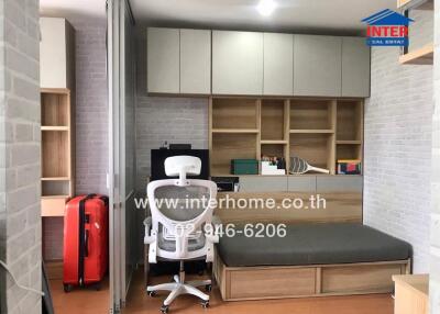 Bedroom with office space and built-in storage