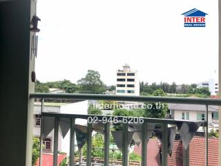 View from the balcony overlooking the town and greenery.