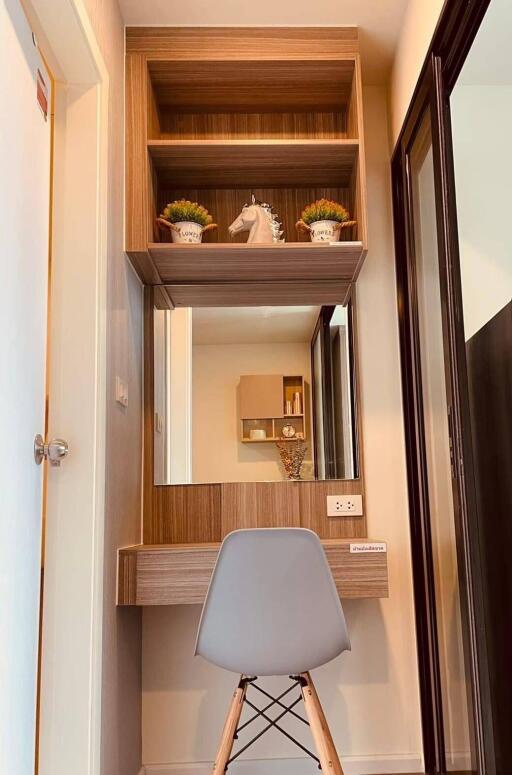 Stylish bedroom vanity with wooden shelves and modern chair