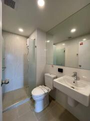 Modern bathroom with shower, toilet, and sink