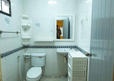 Clean and well-lit bathroom with essential amenities