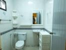 Clean and well-lit bathroom with essential amenities