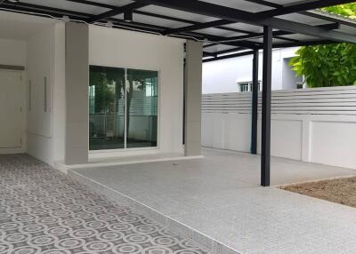 Covered patio with patterned floor tiles