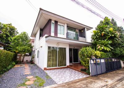 Two-story house with front yard and driveway