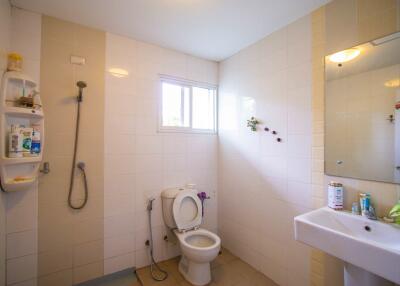 Bathroom with shower, toilet, and sink