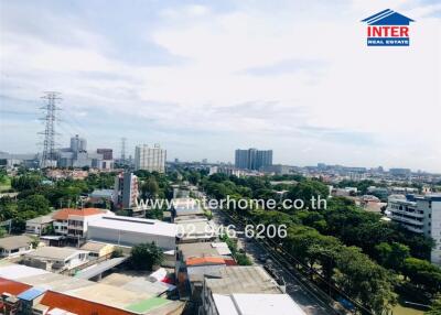 City aerial view with buildings and greenery