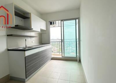 Modern kitchen with city view and balcony access