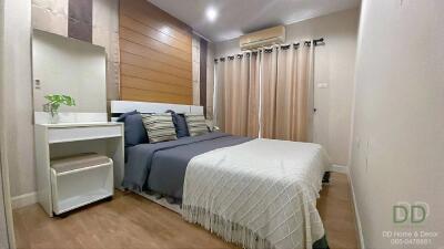 Cozy modern bedroom with double bed and decor