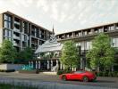 Modern condominium building with greenery and a sports car in the driveway