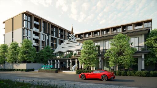 Modern condominium building with greenery and a sports car in the driveway