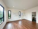 Spacious living room with large windows