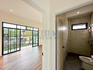 Main living space with view of bathroom