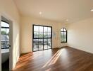 Spacious bedroom with large windows and natural light