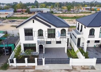 Two-story modern house with front yard