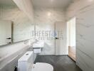 Modern bathroom with white fixtures and marble tiles