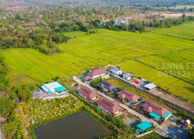 Aerial view of residential area with surrounding landscape