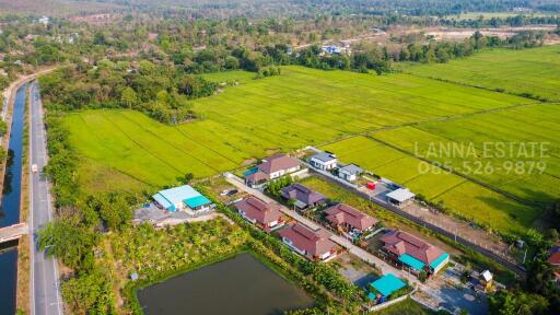 Aerial view of residential area with surrounding landscape