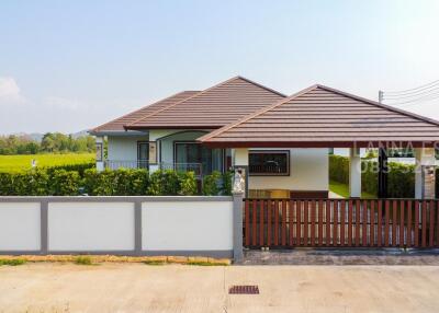 front view of a modern house with yard and driveway