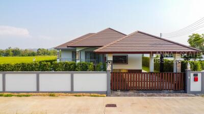 front view of a modern house with yard and driveway