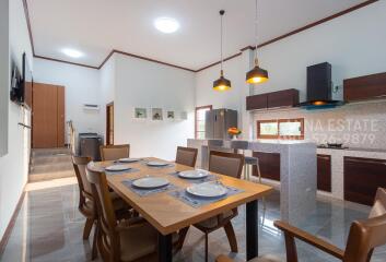 Modern kitchen and dining area with wooden accents