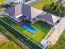 Aerial view of a modern house with a pool