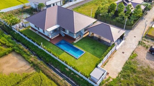 Aerial view of a modern house with a pool