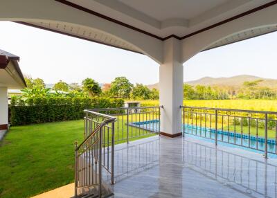 Outdoor patio with pool and garden view