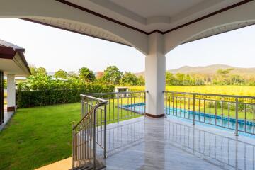 Outdoor patio with pool and garden view