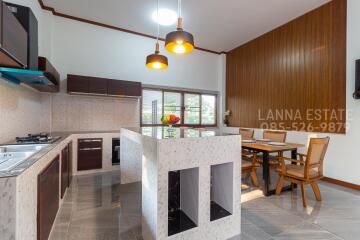 Modern kitchen with island and dining area