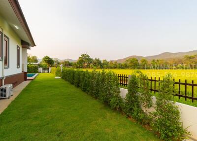 View of the lawn and garden next to the property