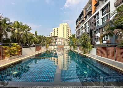 swimming pool with surrounding apartment buildings