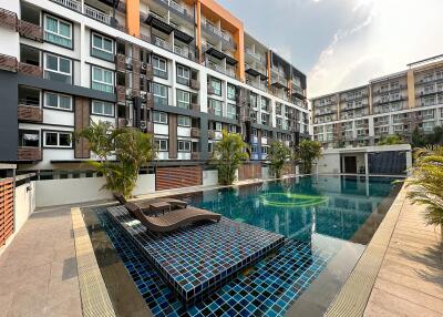 Modern condominium exterior with swimming pool