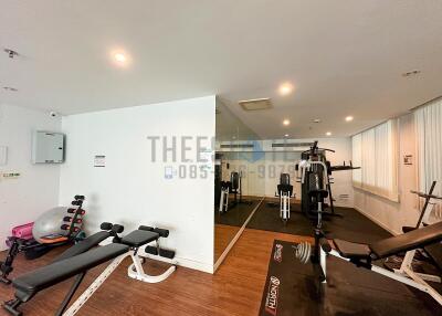 Home gym with exercise equipment and mirrors