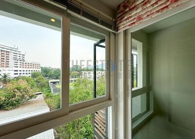 View from an interior with window and blinds