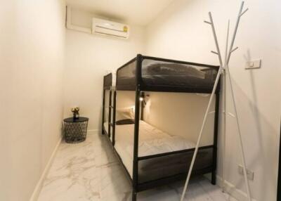 Bedroom with bunk bed and air conditioner