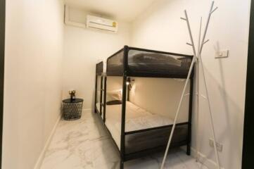 Bedroom with bunk bed and air conditioner