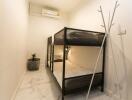 Bedroom with bunk bed and air conditioner