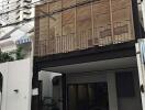 Front view of a modern house with wooden screen facade