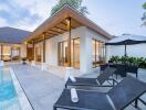 Modern house with poolside seating and outdoor dining area