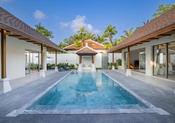 Outdoor pool area with surrounding modern buildings