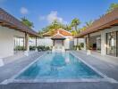 Outdoor pool area with surrounding modern buildings