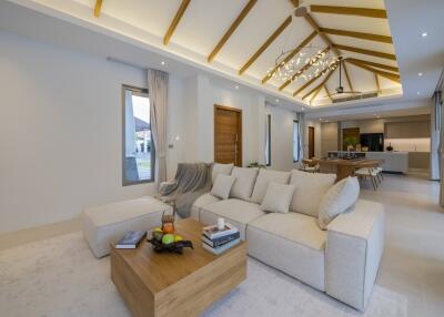 Spacious living room with modern furniture and high ceiling