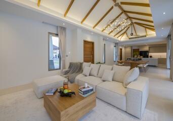 Spacious living room with modern furniture and high ceiling