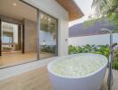 Luxurious outdoor bath with floral decoration and garden view