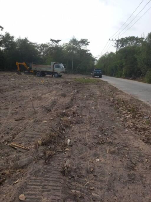 Empty plot of land with vehicles