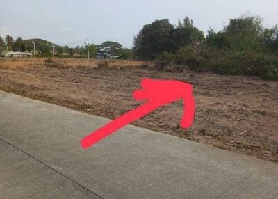 Vacant land with arrow pointing to the property