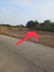 Vacant land with arrow pointing to the property