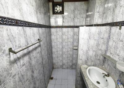 Modern bathroom with tiled walls and a sink