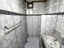 Modern bathroom with tiled walls and a sink