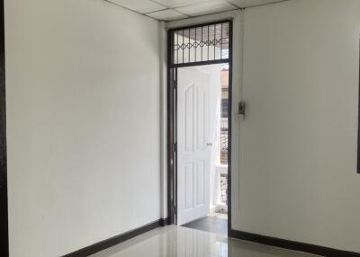 Bedroom with tiled flooring and natural light